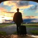 man suitcase sunrise